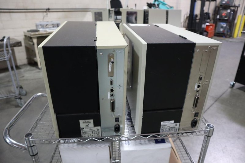 (2) Zebra 110Xi4 Label Printers, 203 dpi, 4&quot; Wide Label Cap - On Wire Cart with Labels- Auction Item