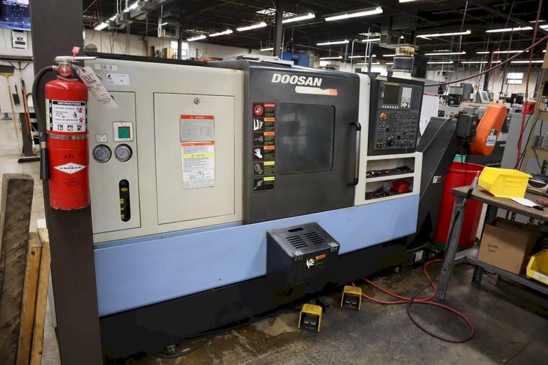 Doosan Lynx 300M CNC Turning Center with Live Milling, 12 Station Turret, 10&quot; 3-Jaw Chuck, Tailstock, Tool Presetter, Parts Catcher, Chip Conveyor- Auction Item