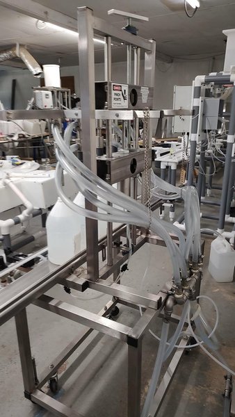 Neumann Packaging SO1A 4-Head Semi-Automatic Overflow Bottle Filling Machine, 2022 – Never Used