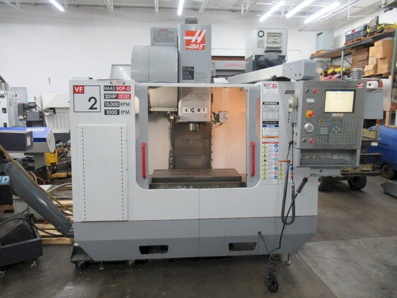 Haas VF-2 CNC Vertical Machining Center with 15,000 RPM CT-40 Spindle, High Speed Machining, Side Mount Tool Changer, 4th Axis Ready, Macros, and Chip Auger.