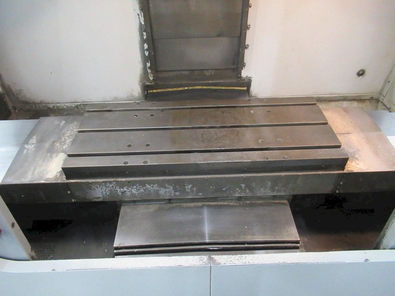 Haas VF-2 CNC Vertical Machining Center with 15,000 RPM CT-40 Spindle, High Speed Machining, Side Mount Tool Changer, 4th Axis Ready, Macros, and Chip Auger.