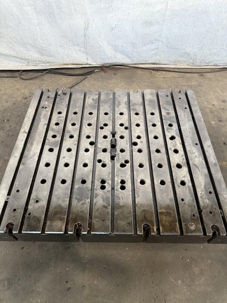 60&quot; WIDE X 67&quot; LONG X 9&quot; THICK T-SLOTTED BOLSTER PLATE. STOCK # 1006324