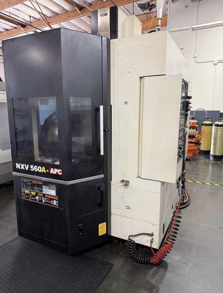 YCM NXV560A-APC VMC, 2015 – Chip Conveyor, Fanuc Control, 12K RPM