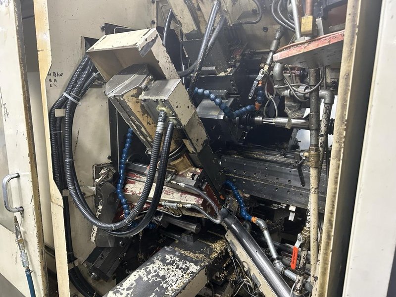 Mitsubishi M-T35E CNC Multi-Spindle Automatic Lathe, 1995 – Chip Conveyor, Bar Feeder