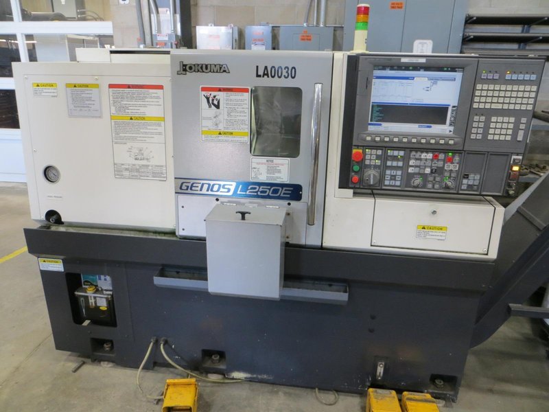 Okuma Genos L250E CNC Turning Center, OSP-P300L/R CNC Control, 8&quot; Chuck, Tool Setter, Parts Catcher, 12-Station Turret, Tailstock, Chip Conveyor