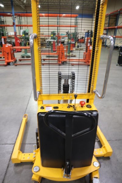 Uline H-5439 Electric Straddle Stacker Lift, 2,200# Cap, 63" Max Height, 50" Between Outriggers, 12 Volt Battery with Charger, 42" Forks- Auction Item