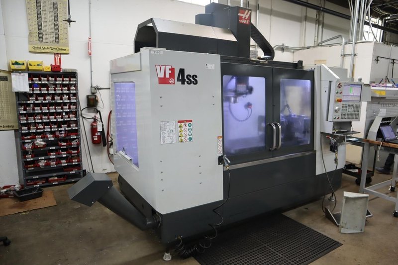 Haas VF-4SS 5-Axis CNC Vertical Machining Center,  12K RPM Spindle, 30 Station SMTC, TSC, Probing, Chip Auger, 4th and 5th Axis Drives with Haas TR-200Y Trunnion Table- NEW 2018- Auction Item
