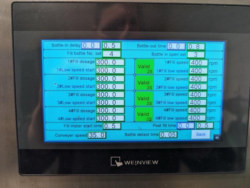 Liquid Filling Line with Automatic 4 Nozzle Servo Gear Pump Filler, Lid Presser, Labeler, Turntables, and Conveyors, 2024
