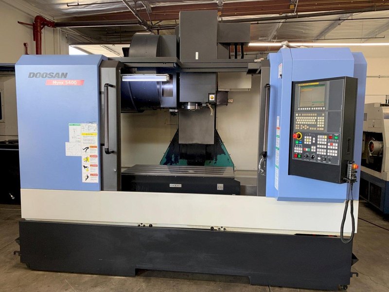 2014 DOOSAN MYNX 5400 with Chip Conveyor Vertical Machining Center