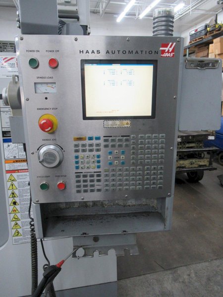 Haas VF-2 CNC Vertical Machining Center with 15,000 RPM CT-40 Spindle, High Speed Machining, Side Mount Tool Changer, 4th Axis Ready, Macros, and Chip Auger.
