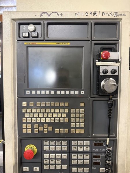 YCM NXV560A-APC VMC, 2015 – Chip Conveyor, Fanuc Control, 12K RPM