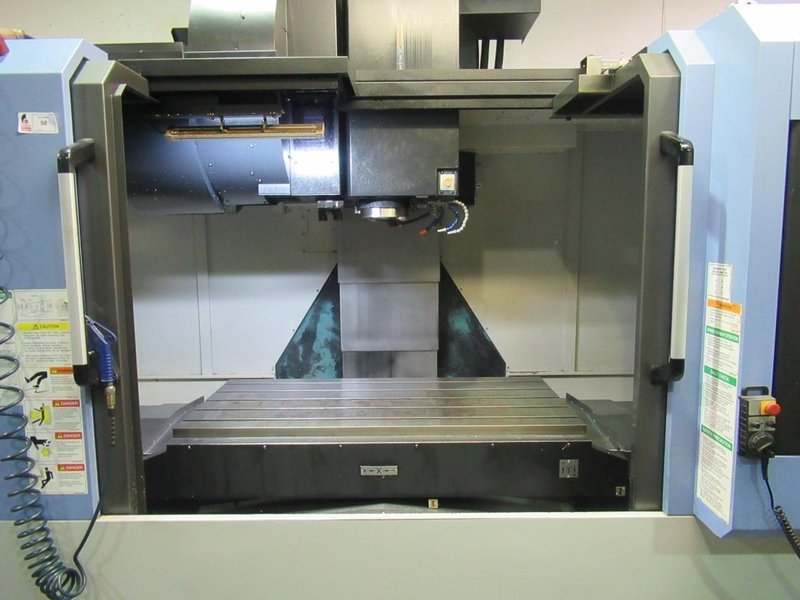Doosan Mynx 6500/40 CNC Vertical Machining Center with Doosan-Fanuc i Series CNC Control,  30-ATC Thru Spindle Coolant, 12,000 RPM, CAT 40,- Auction Item