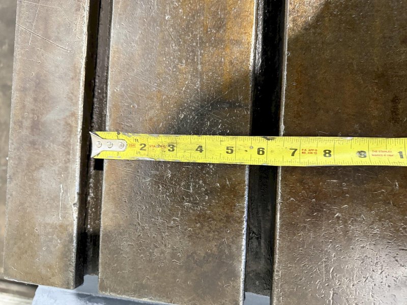 25" WIDE X 89" LONG X 24.5" TALL T-SLOTTED TABLE. STOCK # 0778825