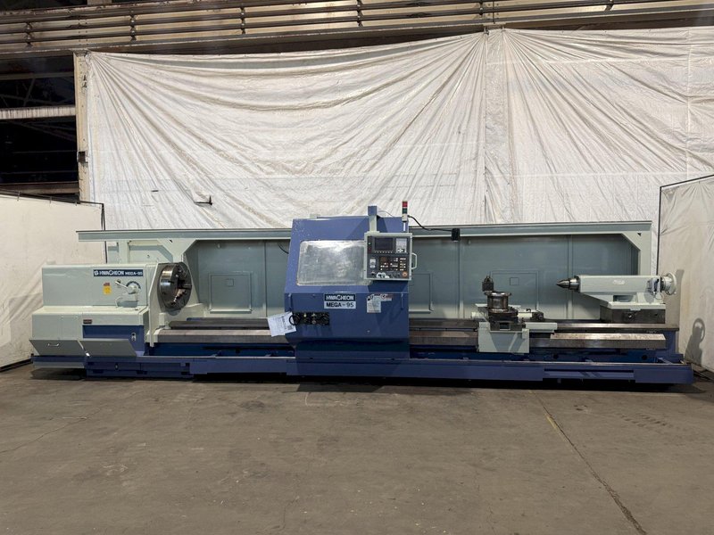 38.6" X 197" HWACHEON MEGATURN 95 CNC 9" HOLLOW SPINDLE OIL FIELD LATHE. STOCK # 0882125