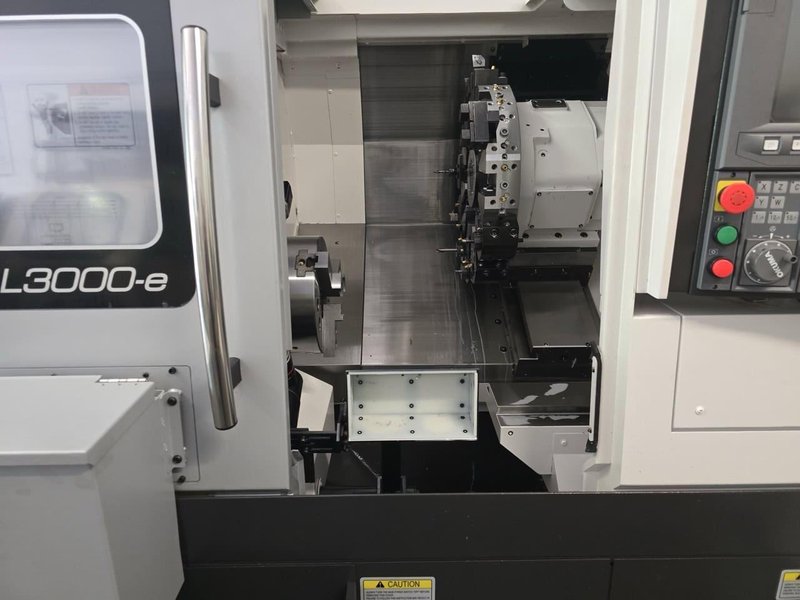 Okuma Genos L3000-e CNC Lathe, 2023 – Parts Catcher, Tailstock, Barfeed Interface