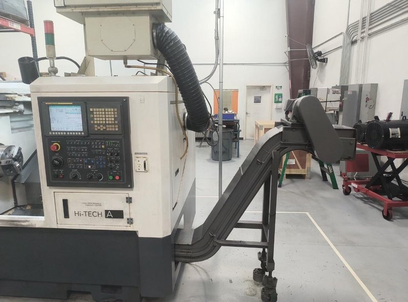 Hwacheon Hi-Tech 200A CNC Lathe, 2009 – Fanuc Oi-TC Control, Mist Buster, Chip Conveyor and Tailstock