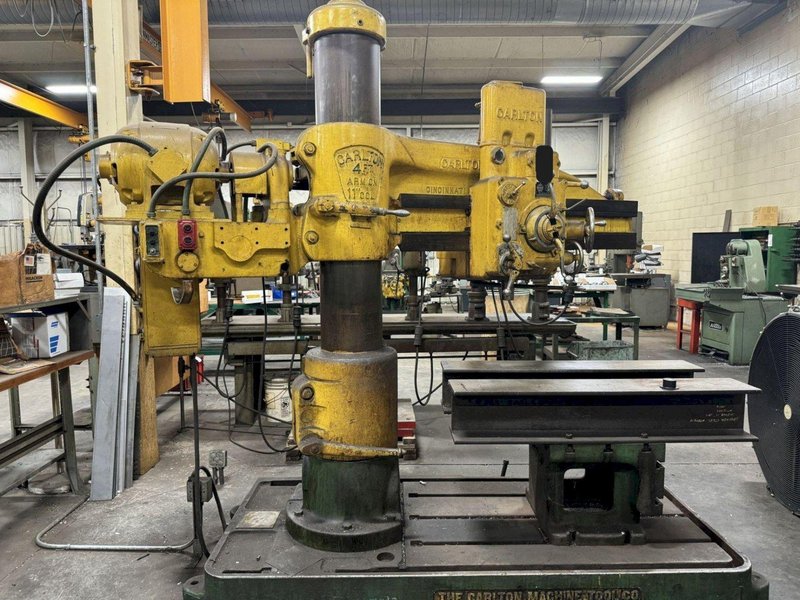 4' X 11" CARLTON RADIAL ARM DRILL. STOCK # 1114024.