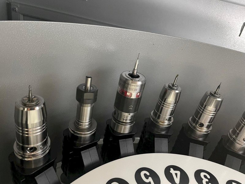 Tornos Almac CU 2007 7-Axis CNC Vertical Machining Center with Part Loading and Parts Catcher System, Probing, 20K Spindle, Lehman 2-Axis Rotary Table, Back Operation Tilting Rotary Vise