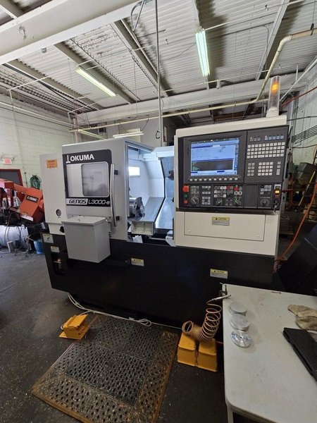 Okuma Genos L3000-e CNC Lathe, 2023 – Parts Catcher, Tailstock, Barfeed Interface
