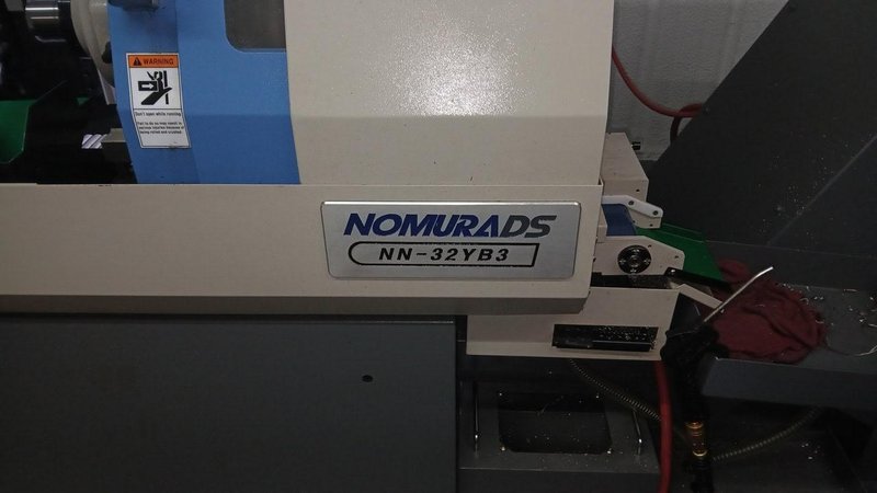 Nomura NN 32YB3, CNC Swiss Screw Machine, 2022 – LNS Alpha 538 Bar Feeder,  TRI-MIST 850 G2 Mist Collector, High Pressure Coolant, LOW HOURS