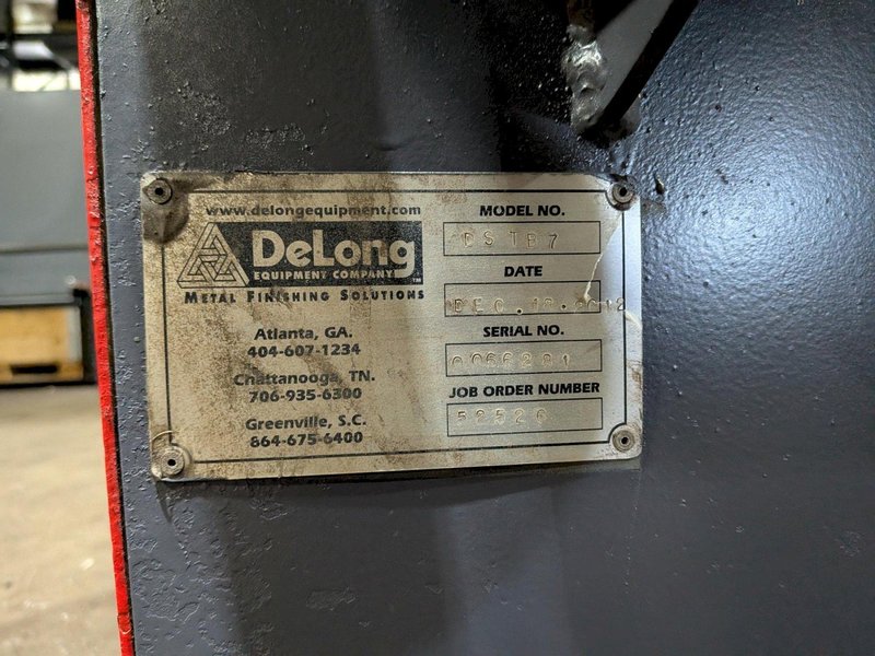 2012 DeLong 7 super model DSTB7 rubber belt tumblast machine s/n 0066281 rated at 7 cu ft capacity, 20hp direct drive shot wheel, offered rebuilt