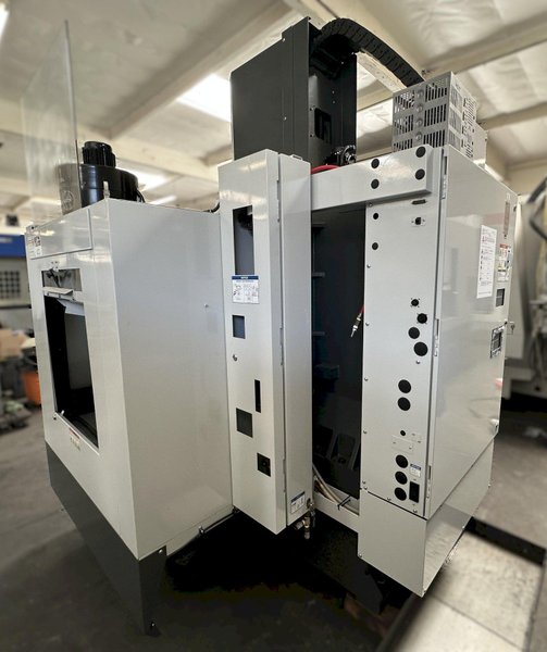 HAAS VM-2 CNC Vertical Machining Center 2011 equipped with quipped with 30"x20"x20" Travels, Haas Control, 4th Axis Drive, 24 ATC Side Mount Tool Changer, Tool Pre-Setter, Cool, Chip Auger