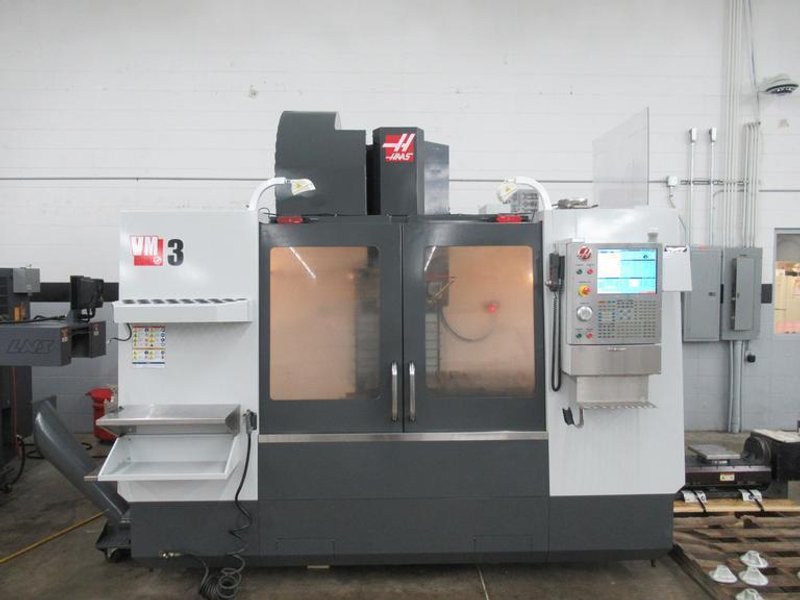 Haas VM-3 5-Axis CNC Vertical Machining Center, Haas TR-210 Trunnion, 40 Station Tool Changer, Probing, 300 PSI TSC, Chip Auger