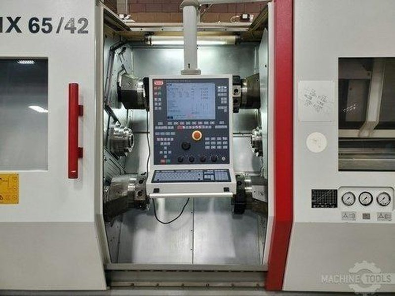 TRAUB TNX 65/42 Multi-Axis Lathe, 2007- Reconditioned,15-Axis, 4 Turret, Live Tooling, Bar Feeder, Twin Spindle, Chip Conveyor, Available Tooling