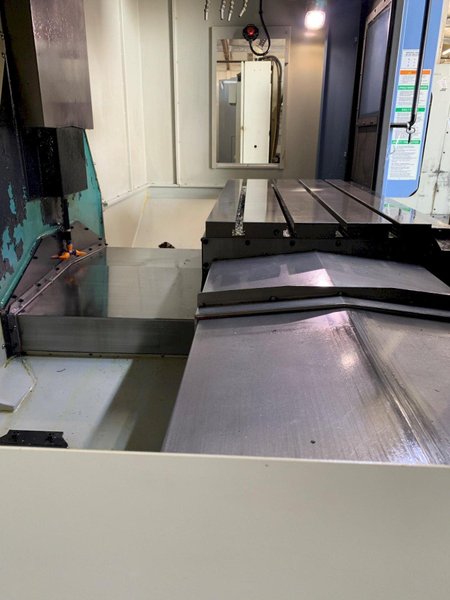 2014 DOOSAN MYNX 5400 with Chip Conveyor Vertical Machining Center