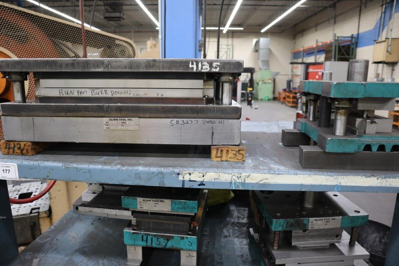Press Dies on Steel Rack- Auction Item