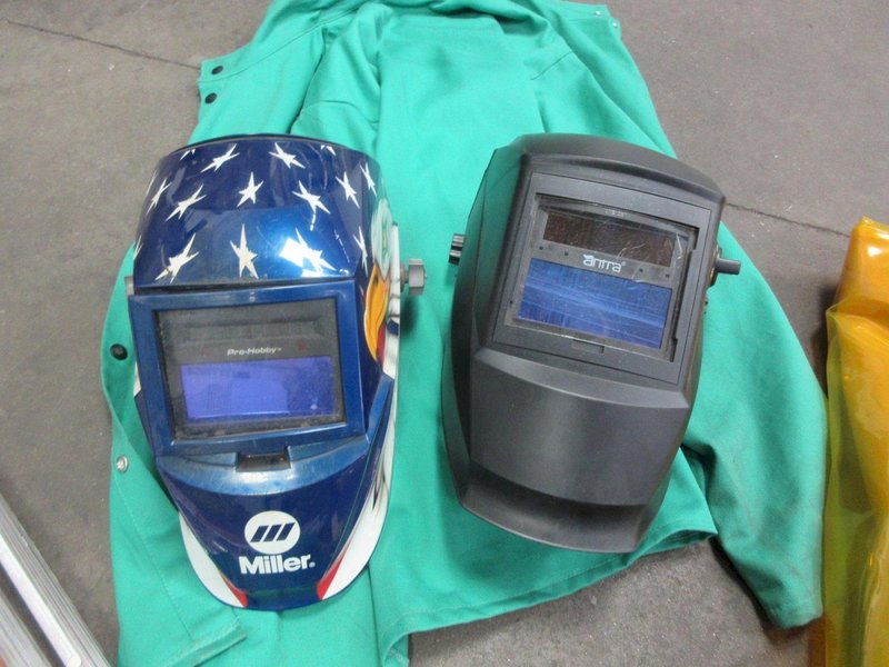 Welding Equipment: (2) Darkening Welding Helmet, (2)Curtains , 2XL Welding Jacket, Welding Wire, Brush- Auction Item