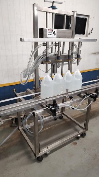 Neumann Packaging SO1A 4-Head Semi-Automatic Overflow Bottle Filling Machine, 2022 – Never Used