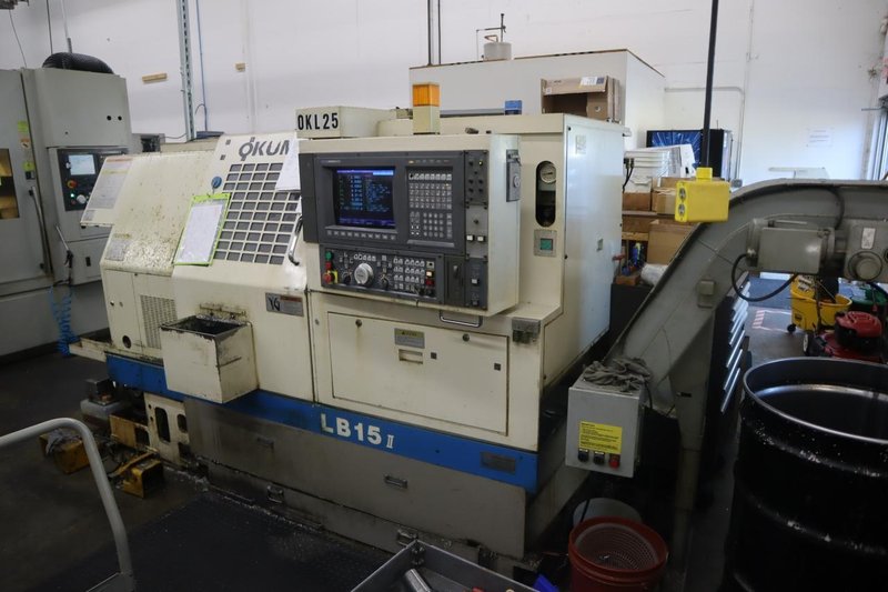 Okuma LB15 II CNC Lathe Turning Center, OSP700L CNC, 12 Station Turret, Tailstock, 8&quot; Chuck, Chip Conveyor- Auction Item