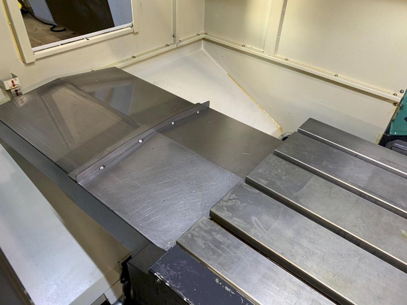 2014 DOOSAN MYNX 5400 with Chip Conveyor Vertical Machining Center