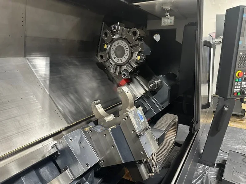 2023 DN SOLUTIONS PUMA 4100LMB CNC Universal Turning Center. Equipped for versatile 2-axis and 3-axis lathing, it features a 15" chuck, 50 HP spindle, and a machining length of 79.8" and with hydraulic open / close steady rest. Perfect for heavy-duty tasks. Fanuc Control, 50HP