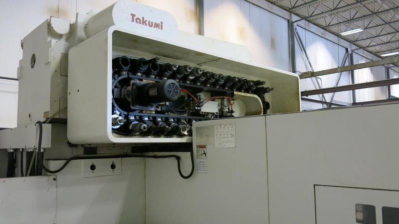 TAKUMI, V32, CNC VERTICAL MACHINING CENTRE, 10,000 RPM SPINDLE, TRAVELS (X,Y,Z): 3200 MM X 1066MM X 750 MM (126&quot; X 42&quot; X 30), DISTANCE FROM NOSE TO SPINDLE:  200MM TO 950MM, DISTANCE FROM SPINDLE NOSE TO THE Z-AXIS GUIDEWAY: 1120MM, T-SLOT TABLE SIZE: 3200MM X 1025MM (126&quot; X 40&quot;), MAX TABLE LOAD, 4500 KG (9,920 LBS), 32 TOOL ATC, TABLE SIZE: 42&quot; X 130&quot;, CAT 50, 30 KW, SPINDLE FLOOD AND THROUGH COOLANT, AIR BLAST, COOLANT FILTER SYSTEM, CHIP WASH DOWN SYSTEM, CHILLED BALL SCREW AND SPINDLE, 4-AXIS CAPABLE,  LEFT AND RIGHT CHIP CONVEYOR,  MITSUBISHI, MEDLAS 60S, CNC CONTROL, 2006, 220/3/60 50 AMP, MACHINE WEIGHT:  52.500 LBS. FLOOR SPACE (W, L, H) 295&quot; X 173&quot; X 139.7&quot; (APPROX.), S/N K0133