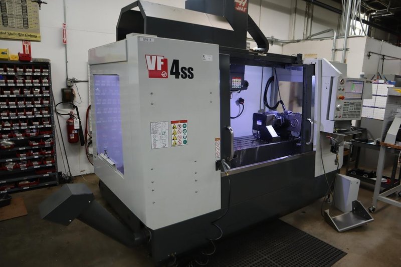 Haas VF-4SS 5-Axis CNC Vertical Machining Center,  12K RPM Spindle, 30 Station SMTC, TSC, Probing, Chip Auger, 4th and 5th Axis Drives with Haas TR-200Y Trunnion Table- NEW 2018- Auction Item
