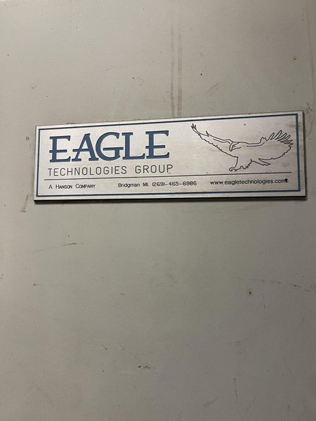 2005 Eagle automated saw and knockout system s/n 05027 with enclosure with light curtain, 2005 Fanuc robot model M-900iA 350 s/n r05743652 with Fanuc system R-J3iB controls s/n e05608535, with saw grips, Eagle enclosure with core knockout system, Allen Bradley plc with panelview 700, core butt discharge conveyor with drive, gate and riser dropoff, related conveyors