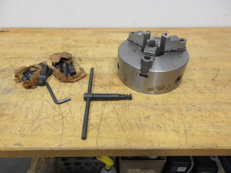 BTC 3-Jaw 10" Manual Lathe Chuck with T-Handle, Reversable Step Jaws and D1-8 Camlock Mounting ** Light Use In Box**- Auction Item