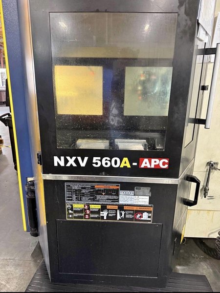 YCM NXV560A-APC VMC, 2015 – Chip Conveyor, Fanuc Control, 12K RPM
