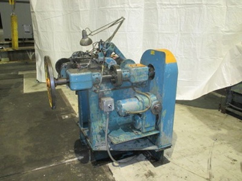 US BAIRD # 1 FOUR SLIDE MACHINE WITH WIRE STRAIGHTENER