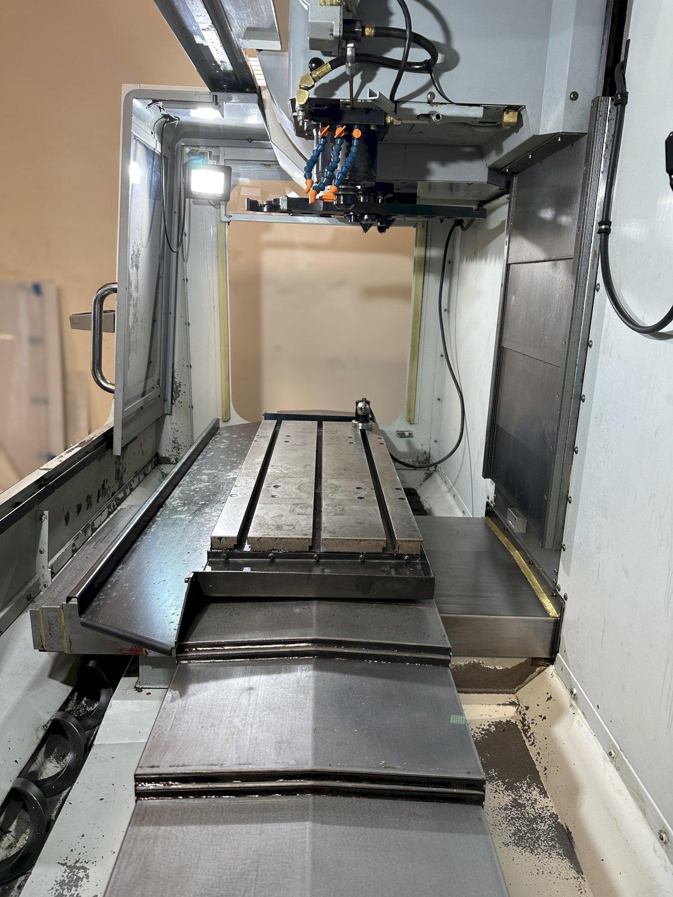 Haas VF-2D Vertical Machining Center 2007 With Rigid Tap, Remote Hand Jog, P-Cool, 4th Axis & 5th Axis Drives, 10,000 RPM Spindle, Chip Auger