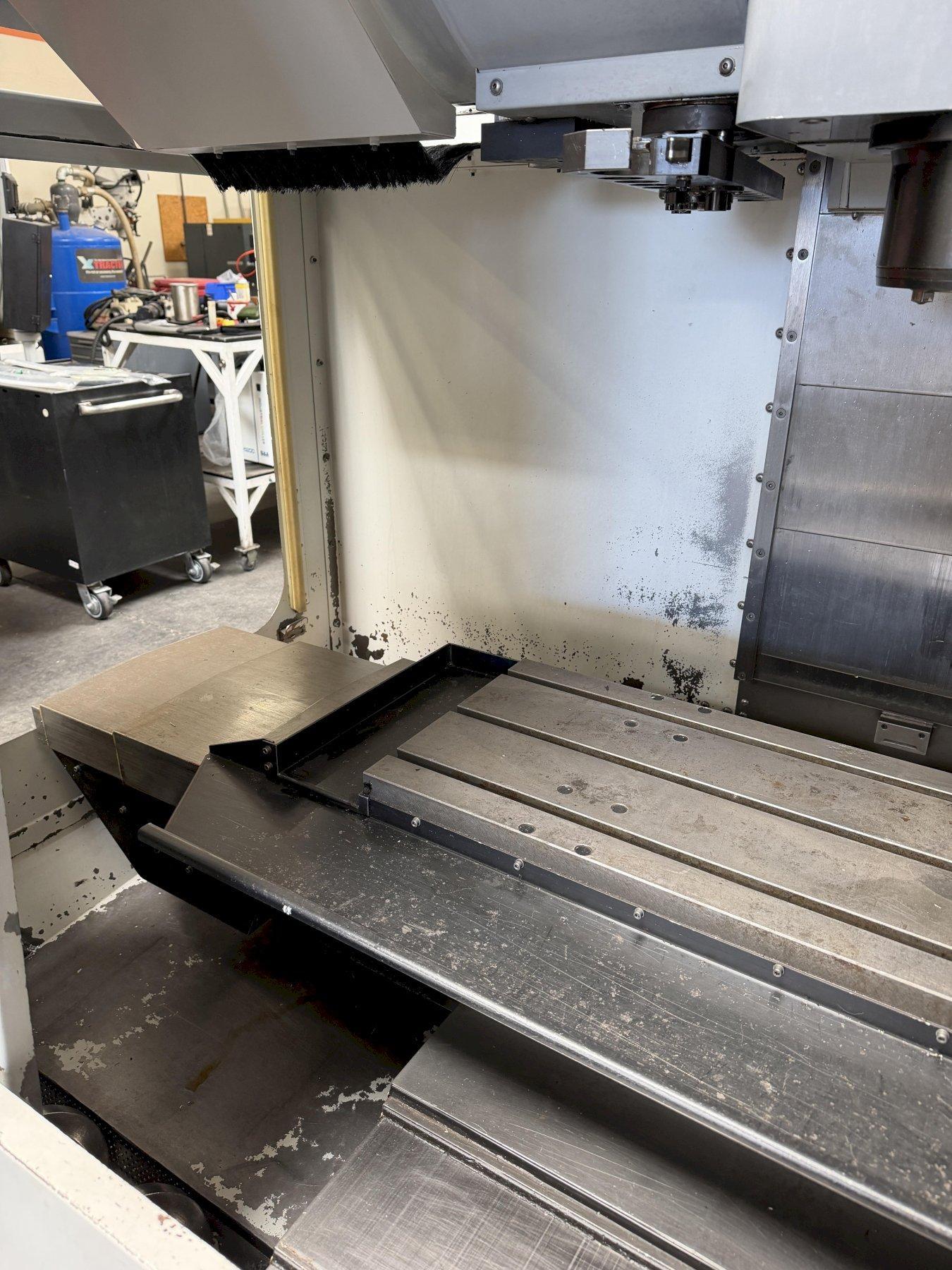 Haas VF-2B Vertical Machining Center 2007 With 2 Speed Gear Box, Rigid Tap, Remote Hand Jog, P-Cool, Hil, 4th Axis Ready, 10,000 RPM Spindle, Chip Auger