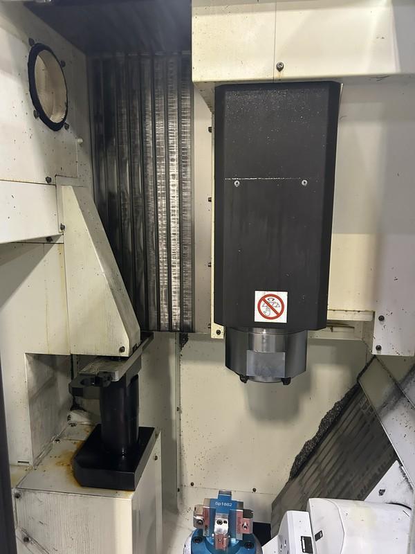 Kitamura Medcenter5AX Vertical Machining Center w/ Arumatik Mi Control, 300-30,000 RPM Direct Drive Spindle, Spindle Oil Cooler, Renshaw NC4+ Blue F115C Probe, High Capacity 40 Tool ATC w/ 120 ATC Upgrade, Raptor SP1882 Tombstone w/ (4) Raptor Vices RWP019SS, Scraper Type Chip Conveyor