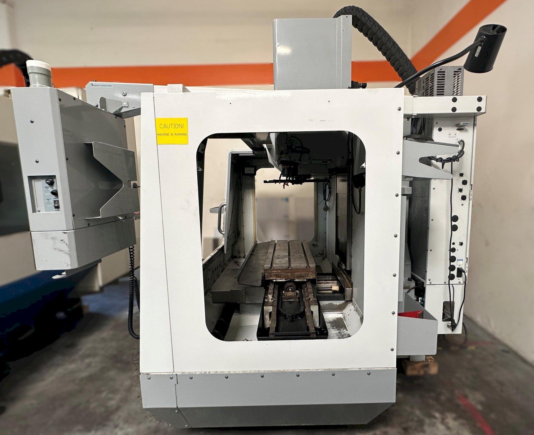 Haas VF-2D Vertical Machining Center 2007 With Rigid Tap, Remote Hand Jog, P-Cool, 4th Axis & 5th Axis Drives, 10,000 RPM Spindle, Chip Auger