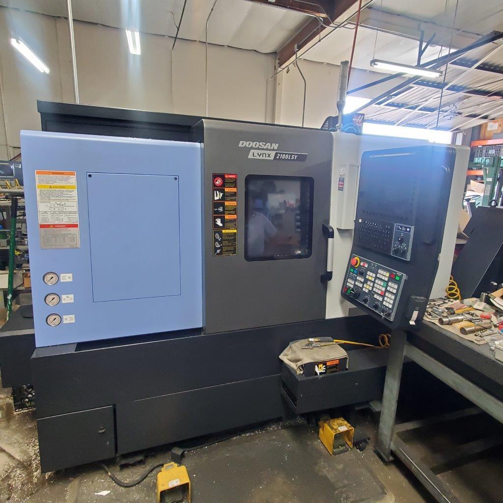 Doosan Lynx 2100LSYB Multi-Axis CNC Lathe 2020 with: Fanuc i Series CNC Control, 4 Live Tooling, Static Holders, Royal Collet Chuck’s, 8” 3 jaws and 5”. 3 Jaw Sub, Collets, Tool Setter, Y-Axis, 