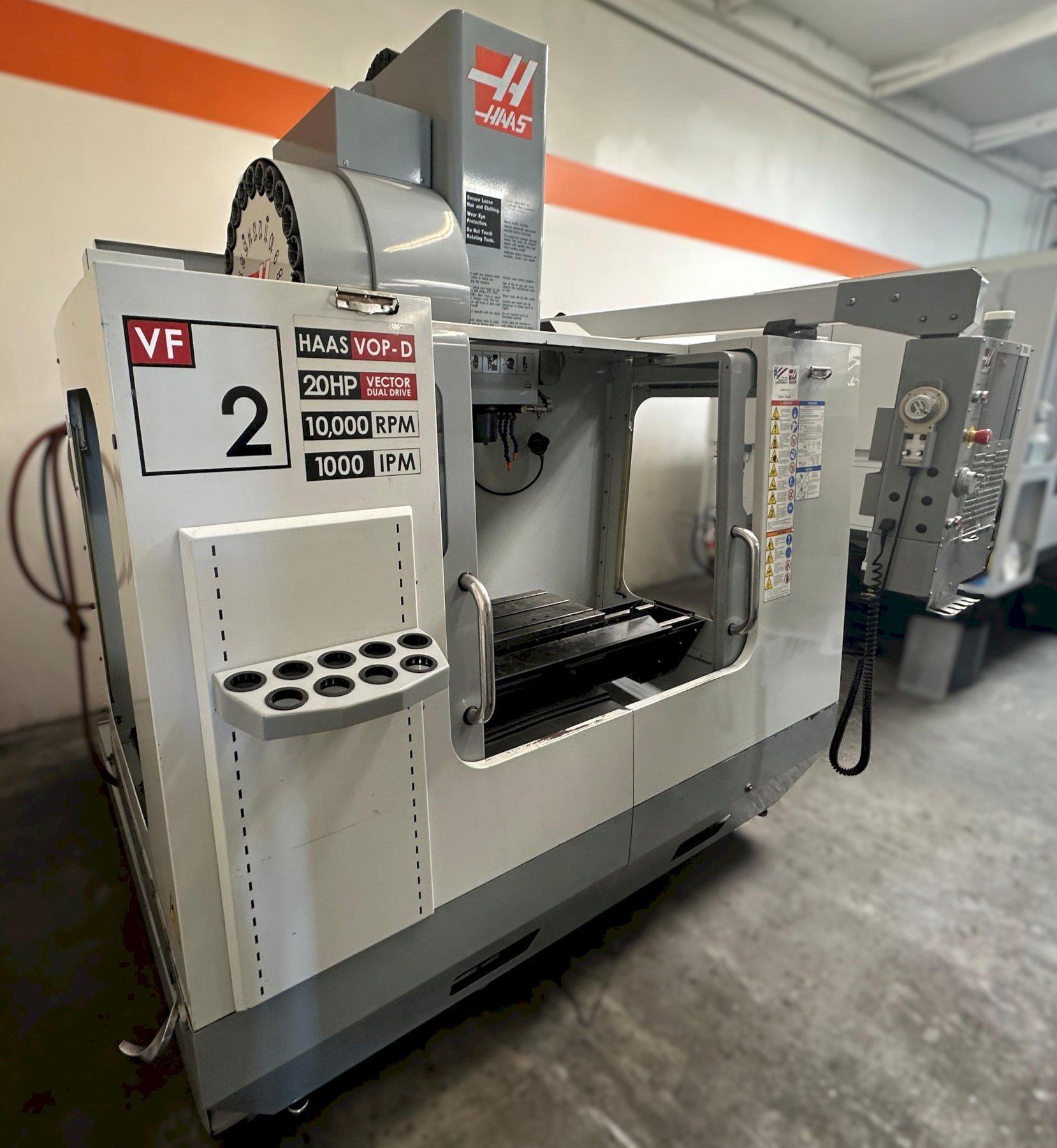 Haas VF-2D Vertical Machining Center 2007 With Rigid Tap, Remote Hand Jog, P-Cool, 4th Axis & 5th Axis Drives, 10,000 RPM Spindle, Chip Auger