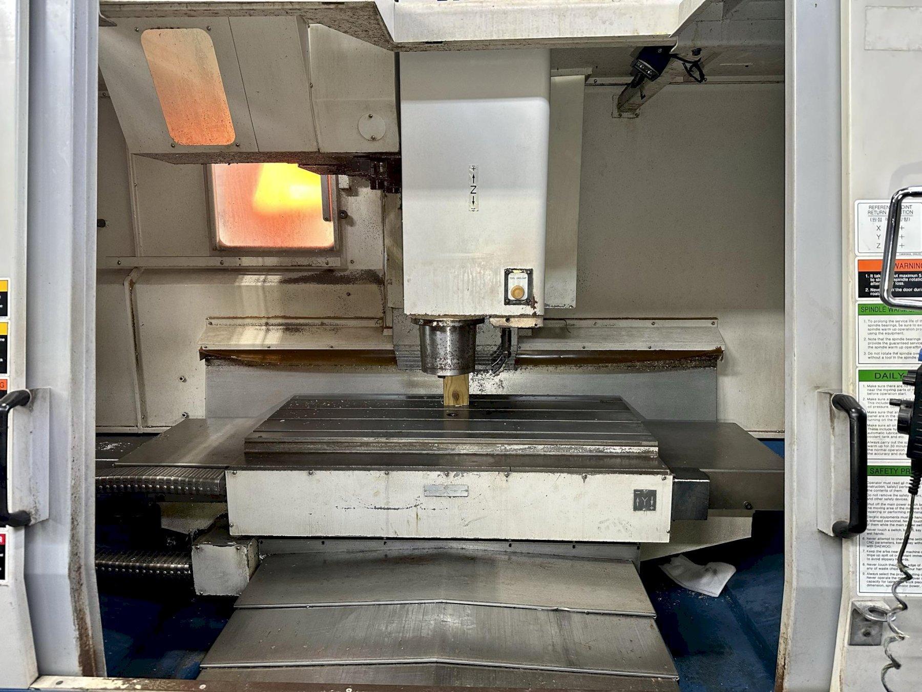 DAEWOO DMV-4020S CNC VERTICAL MACHINING CENTER, Fanuc 18iM CNC Control, 47" x 20" Table, X=40", Y=20", Z=20", CAT 40 Taper, 10,000 Max Spindle RPM, 30 ATC, Coolant System & Chip Pan, New 2002.