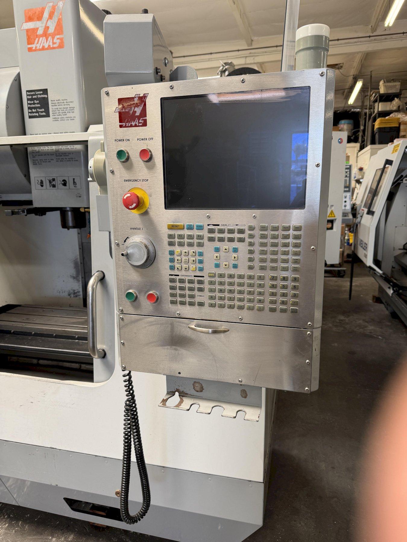Haas VF-2B Vertical Machining Center 2007 With 2 Speed Gear Box, Rigid Tap, Remote Hand Jog, P-Cool, Hil, 4th Axis Ready, 10,000 RPM Spindle, Chip Auger
