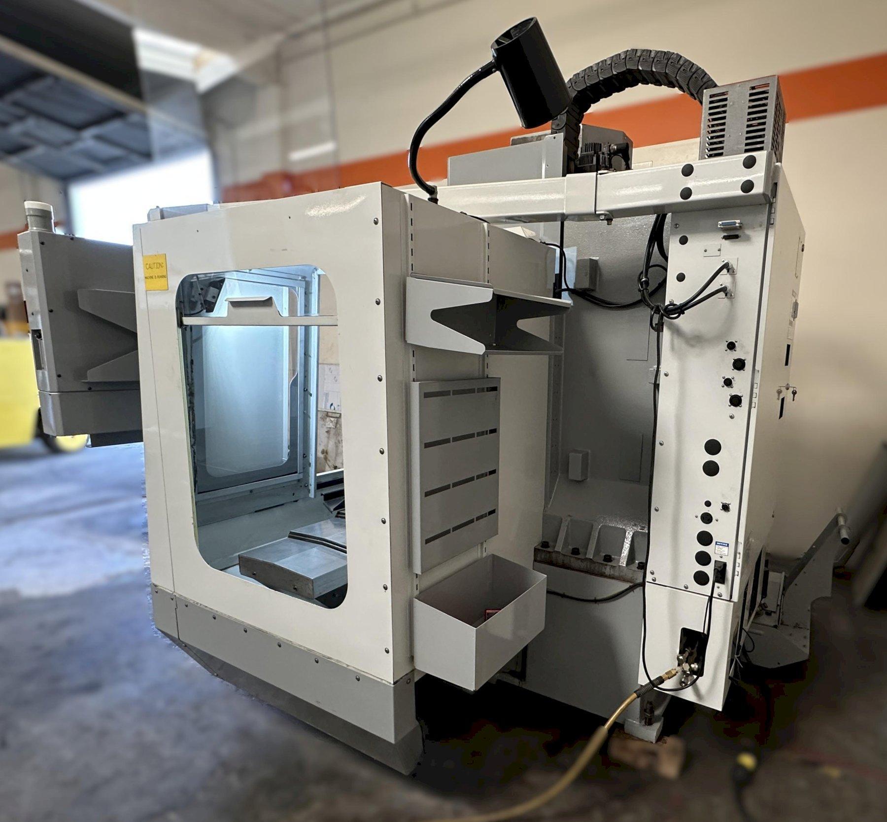 Haas VF-2D Vertical Machining Center 2007 With Rigid Tap, Remote Hand Jog, P-Cool, 4th Axis & 5th Axis Drives, 10,000 RPM Spindle, Chip Auger
